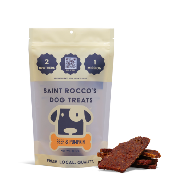 A pouch of Beef and Pumpkin dog treats stands upright with several rectangular treats in front. The packaging features a cartoon dog face and bold text, ideal for training and highlighting these all-natural treats.